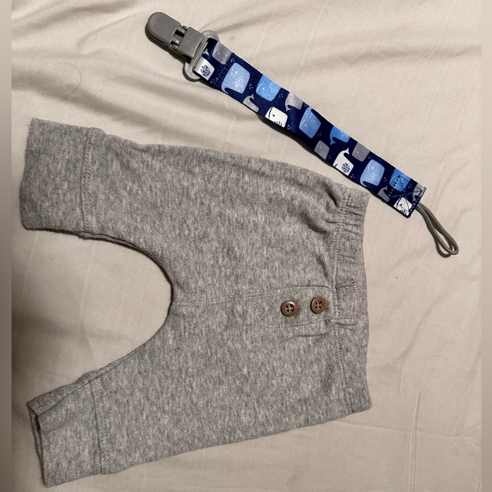 Newborn boy pant never used and pacifier clip never used
